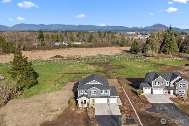 drone / aerial view featuring a rural view and a mountain view