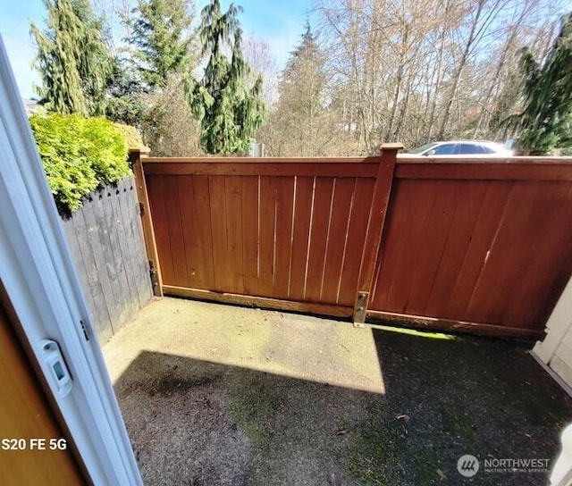 view of gate with fence