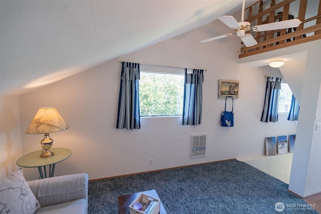 interior space featuring carpet flooring, visible vents, baseboards, ceiling fan, and vaulted ceiling