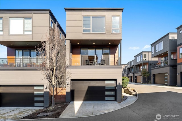 312 7th Ln S Unit 33, Kirkland, WA 98033 - contemporary home featuring an attached garage and driveway