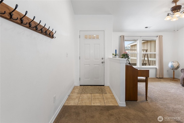 interior space with light carpet, visible vents, and baseboards