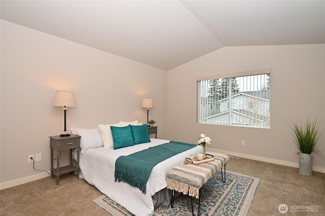 bedroom featuring baseboards, vaulted ceiling, and carpet floors
