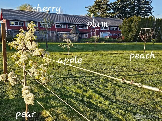 exterior space with a lawn and fence