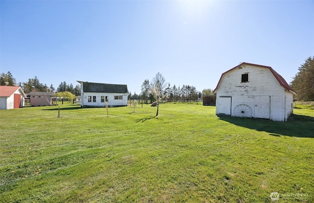 46919 244th Ave SE, Enumclaw, WA 98022 - view of grassy yard featuring a barn and an outdoor structure