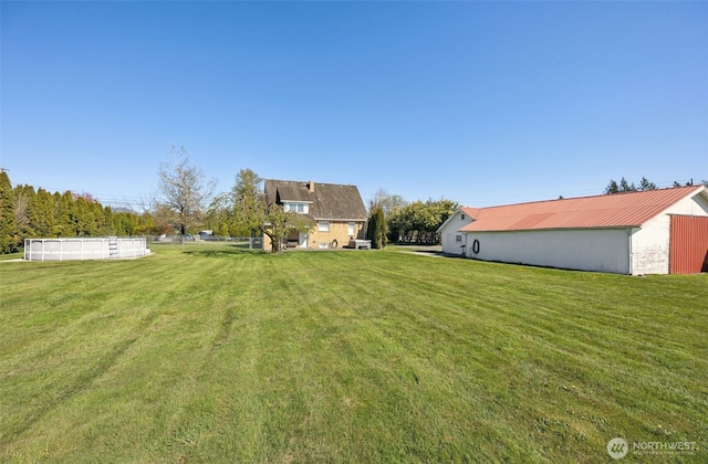 46919 244th Ave SE, Enumclaw, WA 98022 - view of green lawn with an outbuilding and an outdoor structure