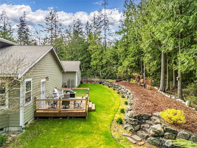 view of yard featuring a wooden deck