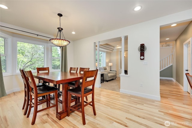dining area with baseboards, light wood-type flooring, stairs, and recessed lighting