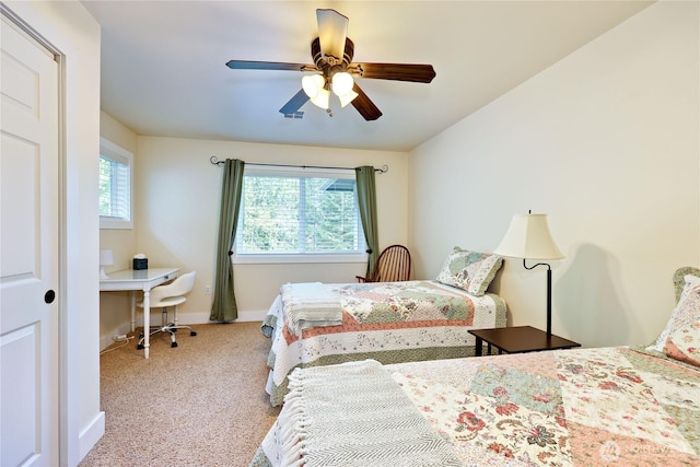 bedroom with carpet, baseboards, and ceiling fan