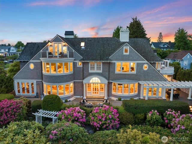 2720 W Galer St, Seattle, WA 98199 - rear view of house featuring a balcony, a pergola, a chimney, and french doors