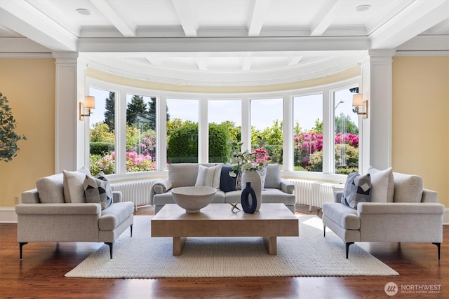 2720 W Galer St, Seattle, WA 98199 - living room featuring crown molding, radiator, beam ceiling, ornate columns, and wood finished floors