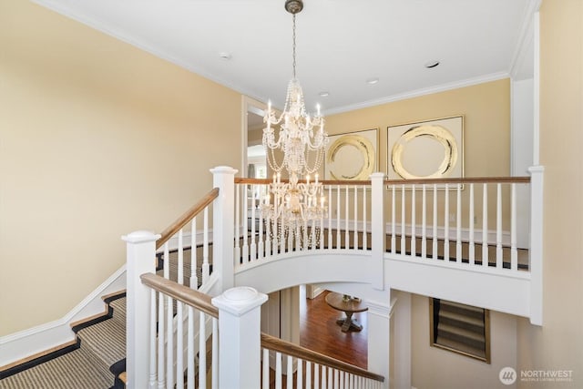 2720 W Galer St, Seattle, WA 98199 - stairway featuring a chandelier, crown molding, and baseboards