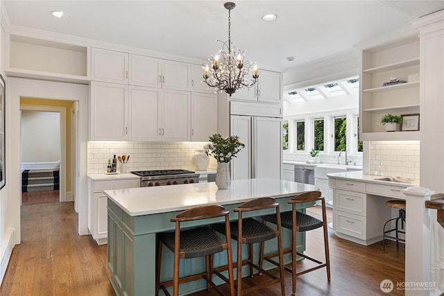2720 W Galer St, Seattle, WA 98199 - kitchen with open shelves, backsplash, range, white cabinetry, and recessed lighting