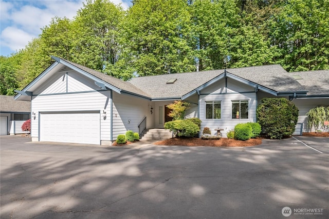 2955 Glenwood Dr Unit 5, Longview, WA 98632 - ranch-style house with a garage, a shingled roof, and driveway