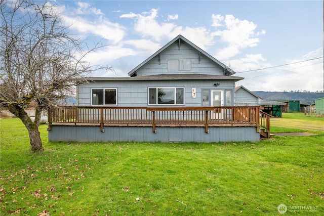 77 S Welcome Slough, Cathlamet, WA 98612 - back of house with a wooden deck and a lawn