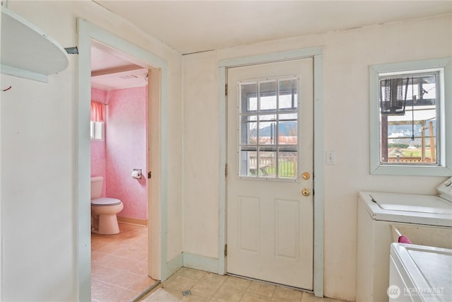 77 S Welcome Slough, Cathlamet, WA 98612 - laundry area featuring baseboards, washing machine and dryer, and laundry area