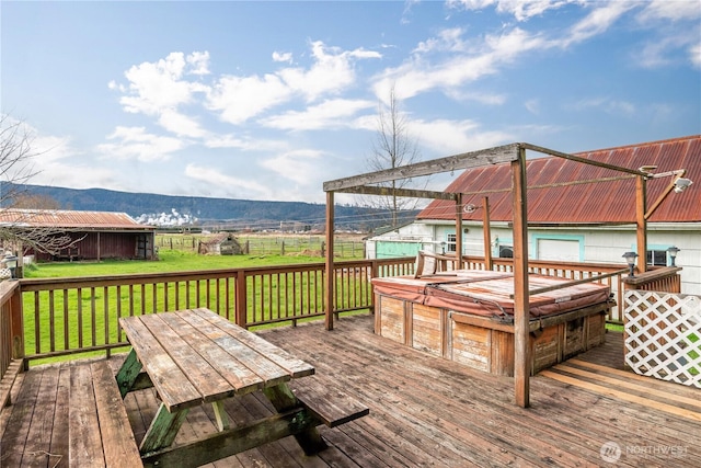 77 S Welcome Slough, Cathlamet, WA 98612 - wooden deck featuring a garage, outdoor dining area, a mountain view, and a yard
