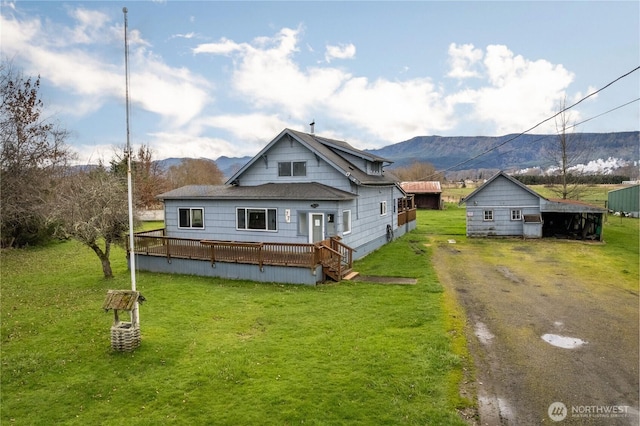 77 S Welcome Slough, Cathlamet, WA 98612 - back of property featuring dirt driveway, a deck with mountain view, and a yard