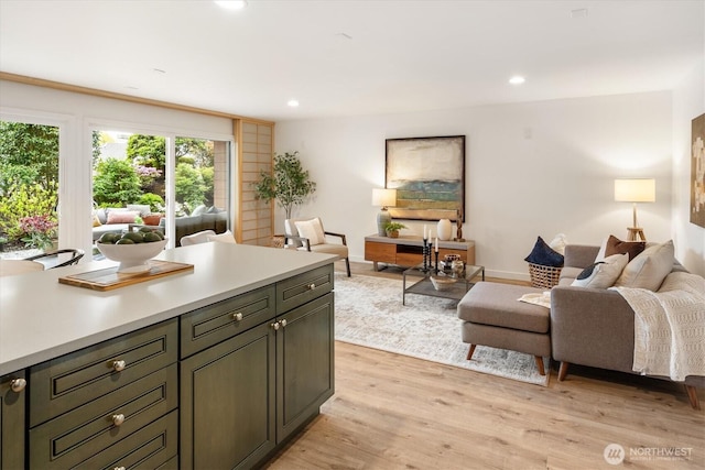 2501 Canterbury Ln E Unit 122, Seattle, WA 98112 - living area with baseboards, light wood finished floors, and recessed lighting
