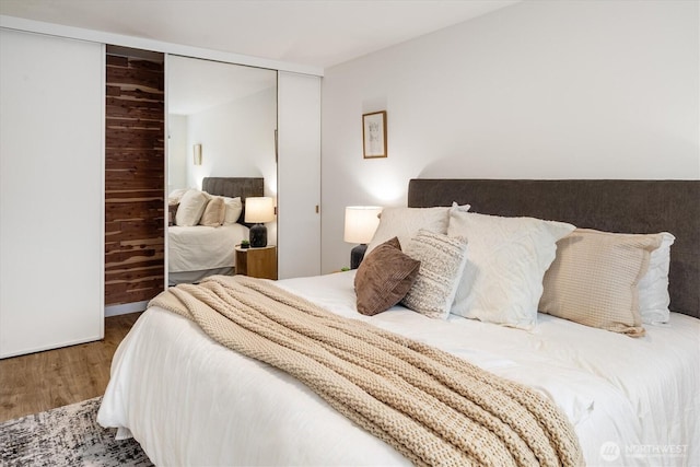 2501 Canterbury Ln E Unit 122, Seattle, WA 98112 - bedroom featuring a closet and wood finished floors