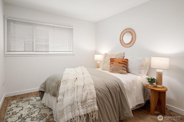2501 Canterbury Ln E Unit 122, Seattle, WA 98112 - bedroom featuring baseboards and wood finished floors
