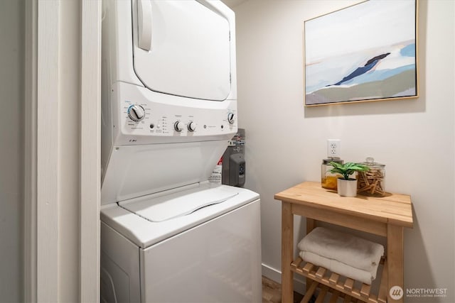 2501 Canterbury Ln E Unit 122, Seattle, WA 98112 - washroom featuring stacked washer / drying machine and laundry area