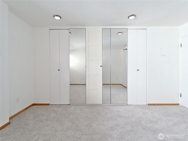 1156 Alki Ave SW Unit 204, Seattle, WA 98116 - unfurnished bedroom featuring baseboards and carpet floors