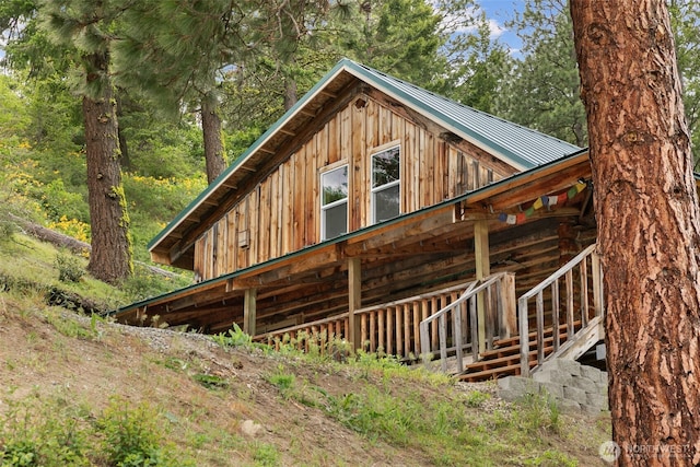 9381 Olalla Cayon Rd, Cashmere, WA 98813 - view of property exterior with metal roof, log exterior, and board and batten siding
