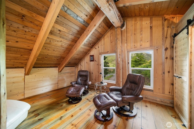 9381 Olalla Cayon Rd, Cashmere, WA 98813 - living area featuring wood ceiling, wooden walls, hardwood / wood-style flooring, and a barn door