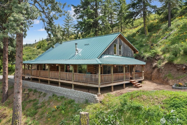 9381 Olalla Cayon Rd, Cashmere, WA 98813 - rear view of house with a porch, metal roof, and log exterior