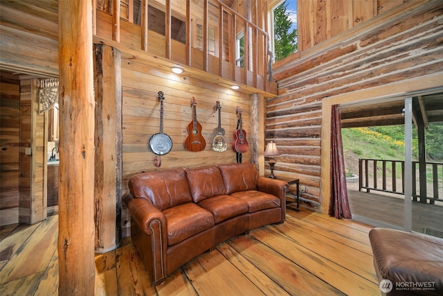 9381 Olalla Cayon Rd, Cashmere, WA 98813 - living area featuring log walls, hardwood / wood-style flooring, and a high ceiling