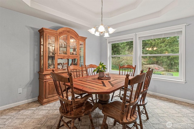 11312 134th Avenue Ct E, Puyallup, WA 98374 - dining area featuring baseboards, a raised ceiling, a chandelier, and light carpet