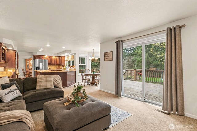 11312 134th Avenue Ct E, Puyallup, WA 98374 - living room with visible vents, baseboards, recessed lighting, and light colored carpet