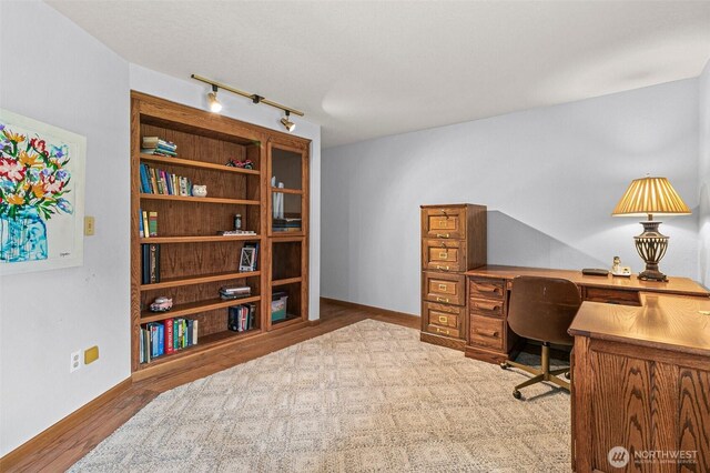 11312 134th Avenue Ct E, Puyallup, WA 98374 - home office with track lighting, baseboards, and wood finished floors