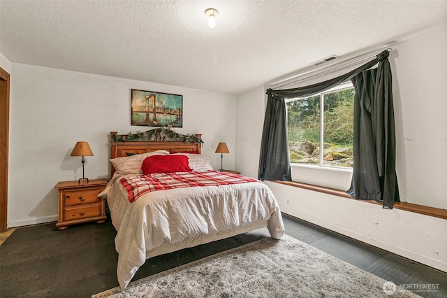 11312 134th Avenue Ct E, Puyallup, WA 98374 - bedroom featuring visible vents, baseboards, carpet, and a textured ceiling