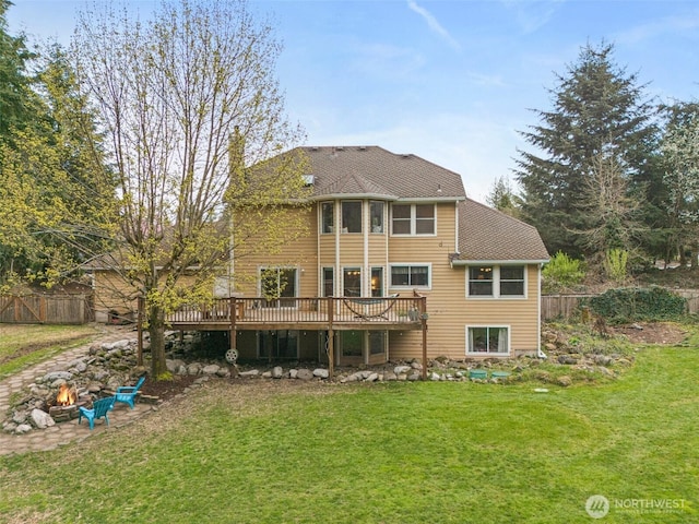 11312 134th Avenue Ct E, Puyallup, WA 98374 - back of property with a yard, an outdoor fire pit, fence, and a deck
