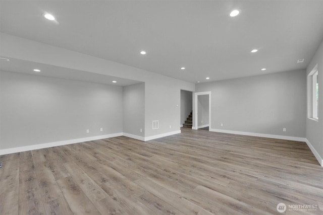 19504 141st Street Ct E, Bonney Lake, WA 98391 - empty room with recessed lighting, light wood finished floors, stairs, and baseboards
