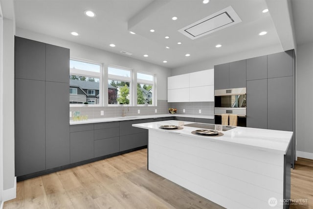 19504 141st Street Ct E, Bonney Lake, WA 98391 - kitchen featuring gray cabinets, a sink, modern cabinets, backsplash, and recessed lighting
