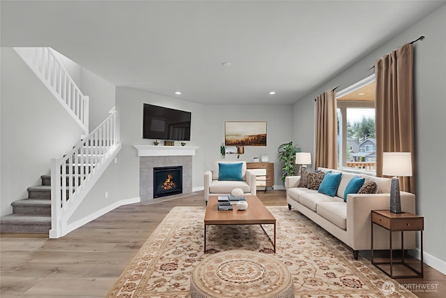 19504 141st Street Ct E, Bonney Lake, WA 98391 - living area featuring light wood finished floors, stairs, recessed lighting, and baseboards