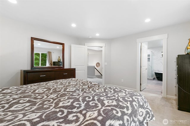 bedroom with baseboards, light carpet, recessed lighting, and a walk in closet