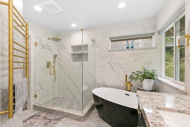 full bathroom featuring a wealth of natural light, visible vents, recessed lighting, and marble finish floor