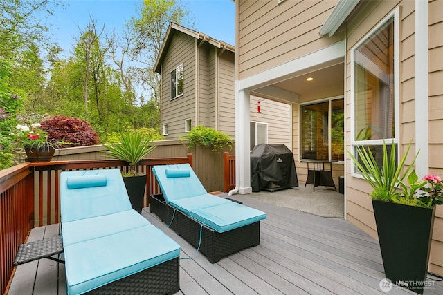 wooden terrace featuring grilling area