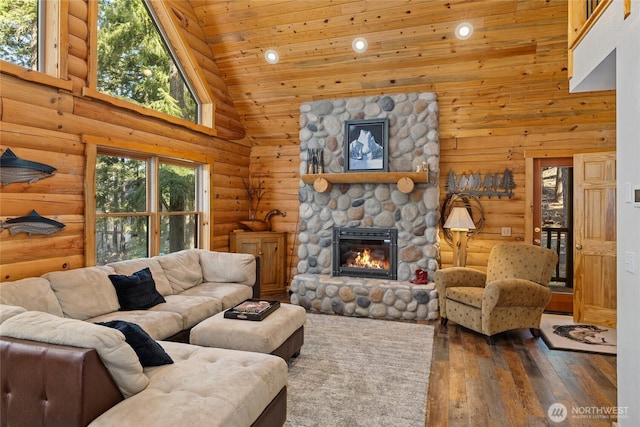 1020 Highland Loop, Ronald, WA 98940 - living area featuring high vaulted ceiling, rustic walls, hardwood / wood-style floors, and a fireplace