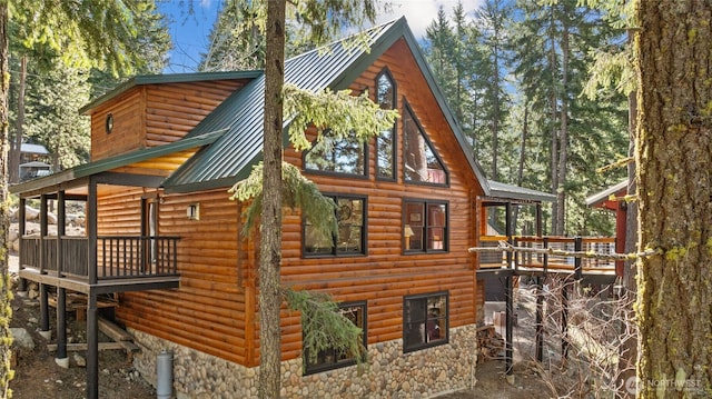 1020 Highland Loop, Ronald, WA 98940 - view of property exterior featuring metal roof, stone siding, and faux log siding