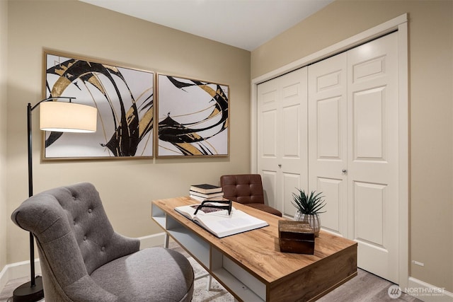 10047 Main St Unit 305, Bellevue, WA 98004 - home office featuring baseboards and wood finished floors
