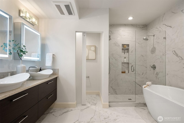 10047 Main St Unit 305, Bellevue, WA 98004 - full bathroom featuring a marble finish shower, baseboards, a soaking tub, marble finish flooring, and double vanity