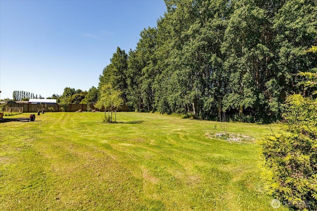 view of yard with fence