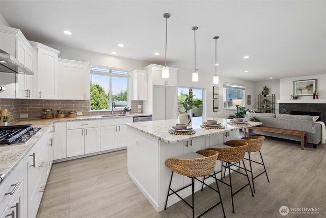 5842 229th Ave E, Buckley, WA 98321 - kitchen featuring stainless steel appliances, plenty of natural light, light wood-type flooring, backsplash, and recessed lighting