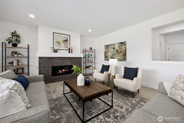 5842 229th Ave E, Buckley, WA 98321 - living room with wood finished floors, a tiled fireplace, and recessed lighting