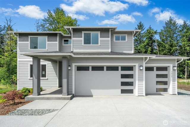 5842 229th Ave E, Buckley, WA 98321 - prairie-style house with concrete driveway and an attached garage