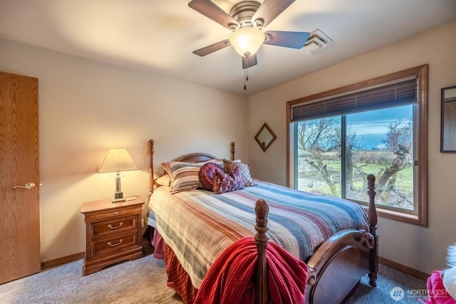 bedroom featuring a ceiling fan, baseboards, light colored carpet, and visible vents